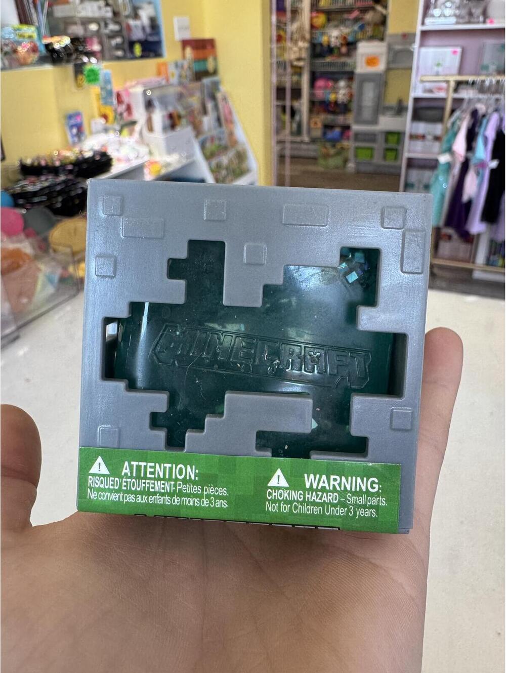 Minecraft jelly squish toy with golden pickaxe